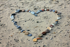 Stones in Heart Shape on Beach